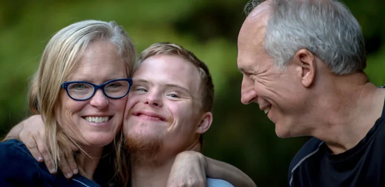 2 adults caring for child